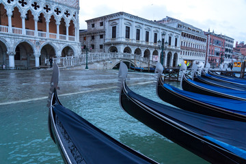 Fototapeta na wymiar VENICE, ITALY - November 24, 2019: St. Marks Square (Piazza San Marco) during flood (acqua alta) in Venice, Italy. Venice high water. Natural disaster