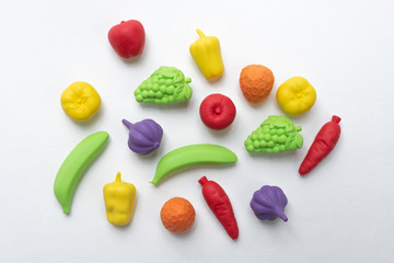 colorful children's toys fruits made of thermoplastic elastomer on a white background