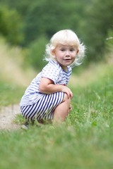 Little girl outdoors in nature portrait emotion