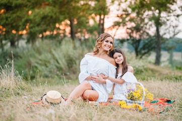 Young mother and her daughter have fun, mother's Day.