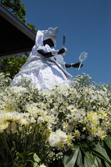 Statue of iemanja with flowers. Santos, Brazil