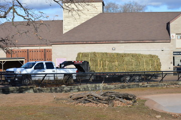 Delivering hay to a building