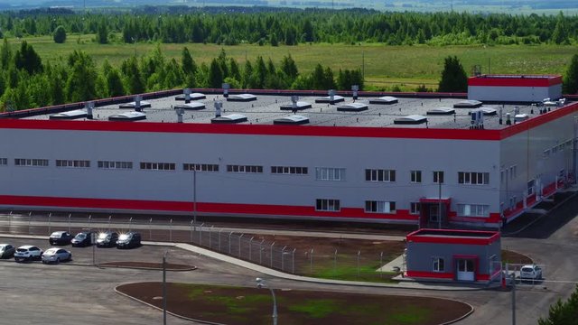 production plant building near green forest bird eye view