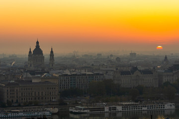 Fototapeta na wymiar Hazy morning and sunrise over St Stephen's Basilica in Budapest, Hungary