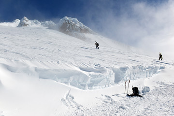 Unidentifiable climbers on snow covered Mount Hood in early Spring