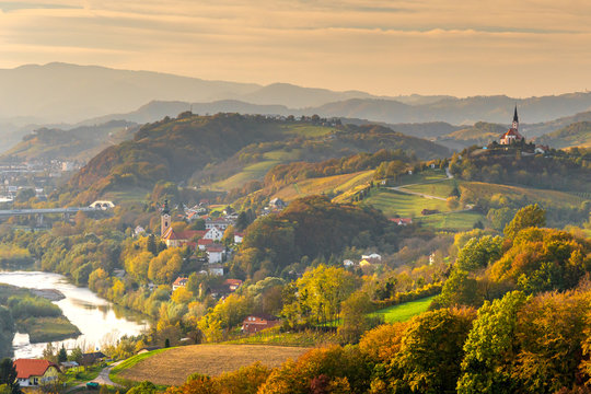 Panoramic view over hills, houses and church in Ptuj area, Slovenia, 2019.