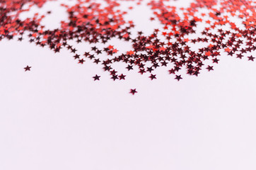 blur background and selective focus, red glitter on pink background