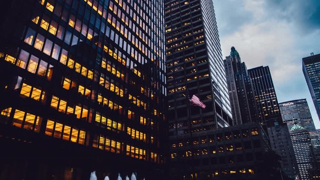 Time lapse effect of metropolitan corporate buildings in commercial financial district for business lifestyle - Manhattan, modern architecture exterior of high offices with glass windows