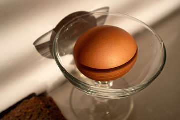 Egg in elegant sauser, for healthy breakfast. Natural food.