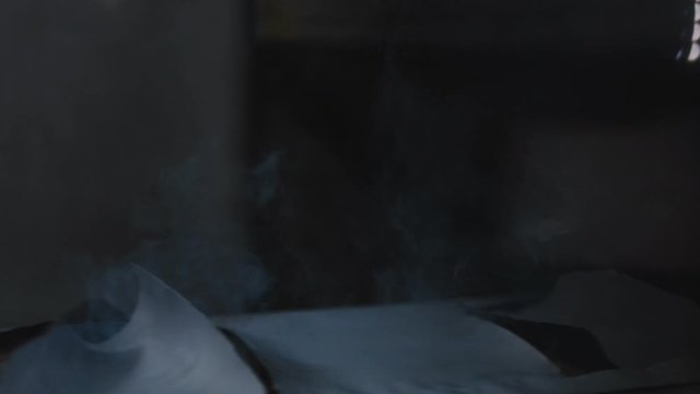 making holes in packs of insulation with flame slow motion