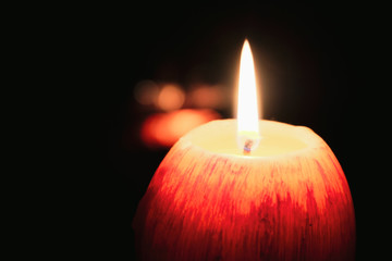 Look at how a single candle can both defy and define the darkness