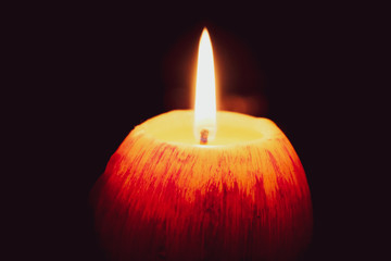 Look at how a single candle can both defy and define the darkness