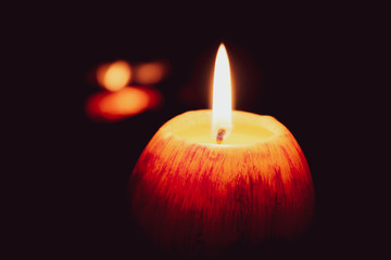 Look at how a single candle can both defy and define the darkness