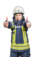 A young smiling fireman girl in a helmet and wearing fireproof uniform, stands and make gesture ok with two hands.