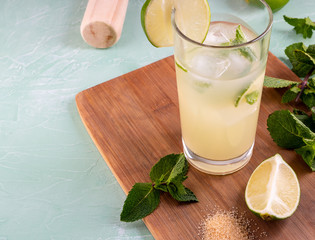 Shaker, lemon, lime, mint leaves and ice for summer cocktail