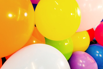 Close-up of inflated balloons of various colors, colorful background for festivities.