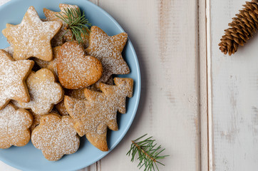 gingerbread christmas cookies in the box on white wooden boards