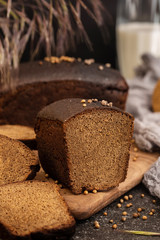 Fresh rye bread on a wooden board. Sliced bread.