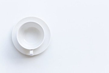 Obraz na płótnie Canvas top view of blank coffee cup on white table