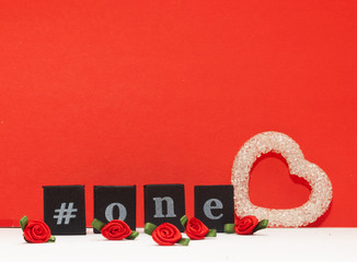 Individual letters that read #one and White heart. red background.