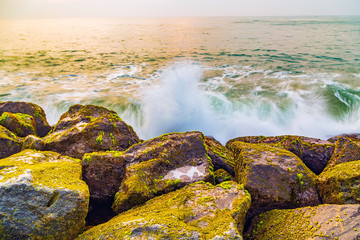 storm waves are breaking about the breakwater