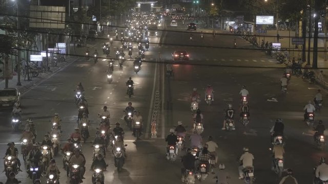 Stock 4k: Traffic in Ho Chi Minh City or Saigon, Vietnam. High-quality free stock video footage of slow moving traffic with lots of motorbike, bus, motorcycles, car... transport on the road in night