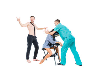 The theme relaxation and rest in office. The queue of employees will be waiting for a massage at the invited specialist. Head and neck massage on the chair. Cheerful Caucasian man in shorts and tie