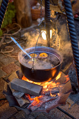 Kettle with hot wine on the fire