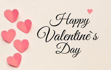 Happy Valentines day text on a sheet of paper. A holiday of love and lovers - concept. High resolution image.