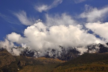 clouds over andes mountains and blue sky