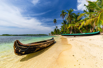 Dugout canoes on beautiful sand beach on San Blas Islands, Panama