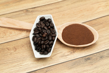 Roasted coffee beans, ground coffee, Cup of coffee, Wooden spoon with roasted coffee