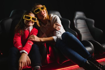 3D reality. People wearing 3D glasses screaming while watching a movie at the local cinema weekend premiere 3D technology shocked surprised scream entertainment activity concept