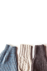 Warm knitted sleeve from a sweater with a pattern. Isolate on white.