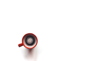 Top view coffee in a red cup, isolated on white background.