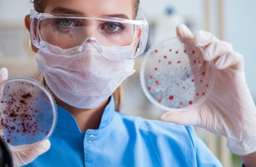 Female scientist researcher conducting an experiment in a labora