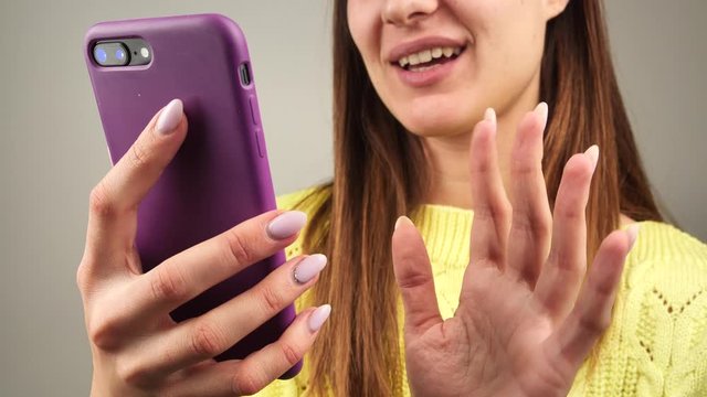 woman communicates via his smartphone. Female talks on phone via skype. 4k