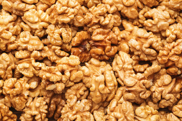 Many tasty walnuts as background