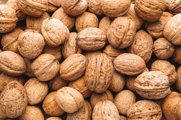 Many tasty walnuts as background