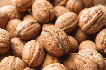 Many tasty walnuts as background