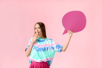 Beautiful young woman with blank speech bubble on color background