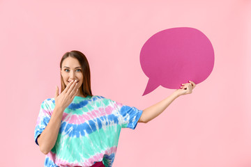 Beautiful young woman with blank speech bubble on color background