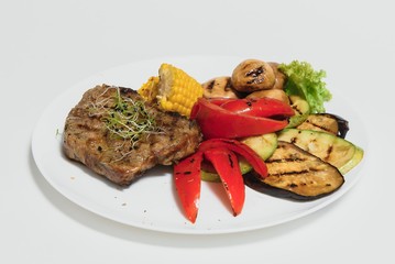 BBQ Steak. Barbecue Grilled Beef Steak Meat with Vegetables. Healthy Food. Barbeque Steak Dinner