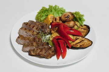 BBQ Steak. Barbecue Grilled Beef Steak Meat with Vegetables. Healthy Food. Barbeque Steak Dinner