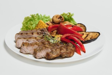 BBQ Steak. Barbecue Grilled Beef Steak Meat with Vegetables. Healthy Food. Barbeque Steak Dinner