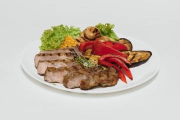 BBQ Steak. Barbecue Grilled Beef Steak Meat with Vegetables. Healthy Food. Barbeque Steak Dinner