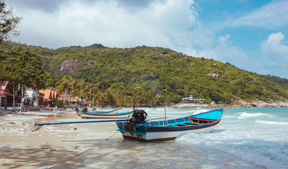 Fishing boats on the beach in Asian tropical sea