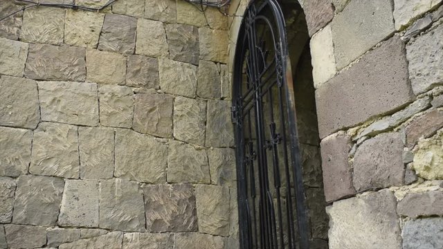 Doors of the Armenian Church. The metal door opens slowly. 