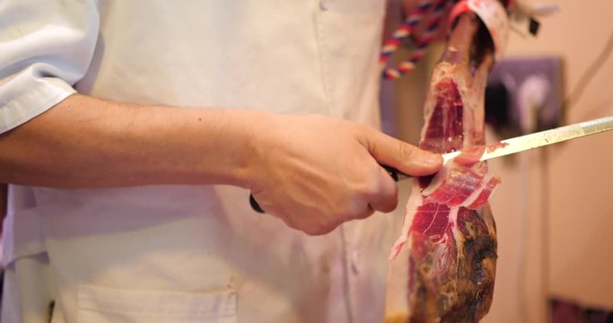 slicing Jamon, Pata Negra in a market, Mercado, Spanish Ham
