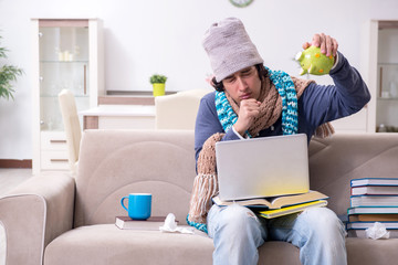 Sick male student suffering at home